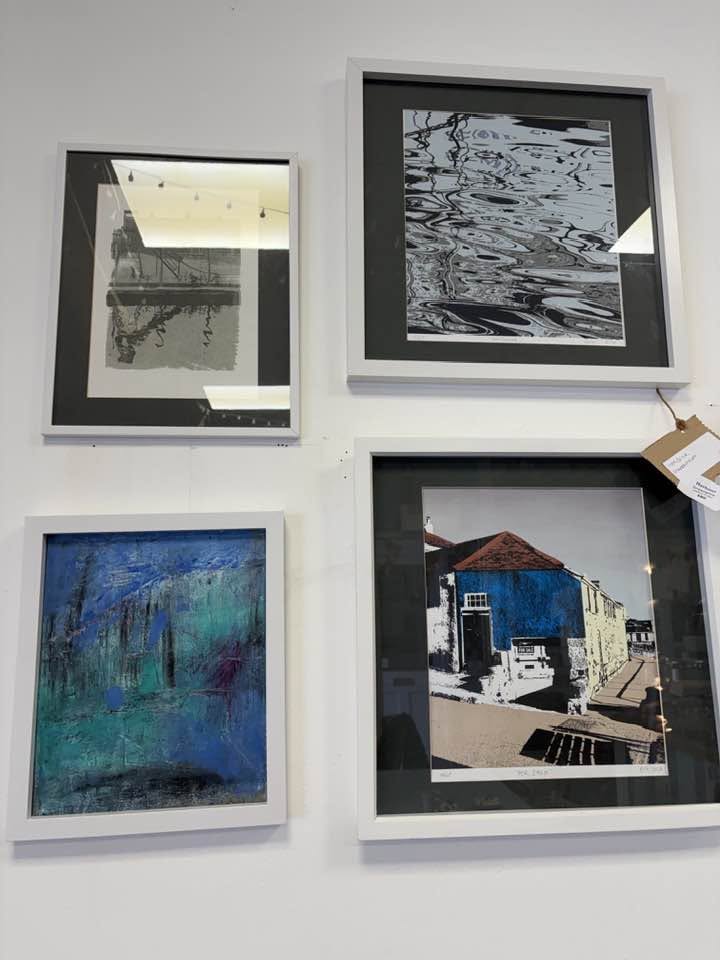 A changing display of framed local artwork at Cafe Art